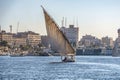 12.11.2018 Aswan, Egypt, A boat felucca sailing along a river of nilies on a sunny day