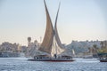 12.11.2018 Aswan, Egypt, A boat felucca sailing along a river of nilies on a sunny day