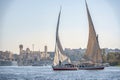 12.11.2018 Aswan, Egypt, A boat felucca sailing along a river of nilies on a sunny day Royalty Free Stock Photo