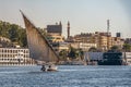 12.11.2018 Aswan, Egypt, A boat felucca sailing along a river of nilies on a sunny day