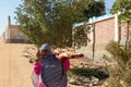 ASWAN, EGYPT - 29 Dec 2022. Mid age nubian, arab, muslim woman with veil and traditional clothing with fresh hand made Royalty Free Stock Photo