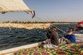 ASWAN, EGYPT: FEB 15, 2019: Crewmen of a felucca sail boat at the river Nile, Egy