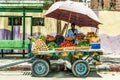 ASWAN EGYPT 20.05.18 Men vegetable seller with rolling store on the street in the city Royalty Free Stock Photo