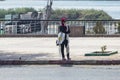 Aswan, Egypt - September 11, 2018: Arabian Woman with hijab drinking a juice in the street