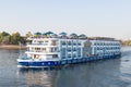 Aswan, Egypt - September 16, 2018: Floating hotel tourist boat motor down the River Nile towards Aswan in central Egypt. The Royalty Free Stock Photo