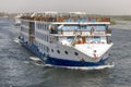 Aswan, Egypt - September 16, 2018: Floating hotels tourist boats motor down the River Nile towards Aswan in central Egypt. The Royalty Free Stock Photo