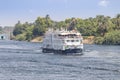 Aswan, Egypt - September 13, 2018: A Tourist boat motor down the River Nile towards Aswan in central Egypt. The tourist boats Royalty Free Stock Photo