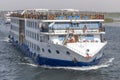 Aswan, Egypt - September 13, 2018: Tourist boat motor down the River Nile towards Aswan in central Egypt. The tourist boats cruise Royalty Free Stock Photo