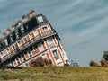 Asymmetric building at the green field in Paris