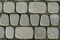 Asymmetric paving slabs of gray color, different size. Background