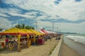 ATACAMES, ECUADOR - March 16, 2016: Unidentified people under a small and rustic tents in Same, Ecuador