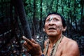 Tribal elder Binan Tukum hunting with his son for monkeys in the rainforest