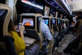 Salon of the night bus next to Istanbul. Passengers, twilight lighting, selective sharpening, blurring, in motion on the highway