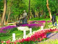 Ataturk Monument among blooming tulips at the entrance to Gulhane Park