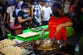 Ate frying some butchi a street food at roxas night market