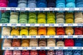 Atelier workshop. A set of colored threads for sewing on reels. A bunch of large multicolored spools of thread Royalty Free Stock Photo