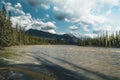 The Athabasca river flows by the Canadian rocky mountains in Alberta, Canada Royalty Free Stock Photo