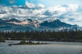 The Athabasca river flows by the Canadian rocky mountains in Alberta, Canada Royalty Free Stock Photo