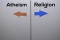 Atheism or Religion with arrow write on white board background