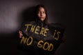 Atheist teen girl holding a banner with the inscription Royalty Free Stock Photo