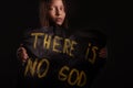 Atheist teen girl holding a banner with the inscription Royalty Free Stock Photo