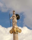 Athena marble statue on Ionic column and partly cloudy sky, space for text.