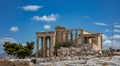 Athens, Greece. Erechtheion with Cariatides Porch on Acropolis hill, blue sky background