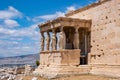 Athens, Greece. Erechtheion with Cariatides Porch on Acropolis hill, blue sky background