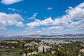 Athens city against blue cloudy sky in a spring day. Aerial view from Acropolis hill. Attica, Greece Royalty Free Stock Photo