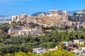 Athens cityscape in summer, Greece. Acropolis hill with famous old Parthenon, top landmark of Athens Royalty Free Stock Photo