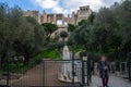 Athens / Greece Acropolis archeological site entrance. Woman, getting out. Sightseeing ancient place access gate