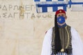 ATHENS, GREECE - APR 25, 2021: Soldier of the presidential guard standing in front of the monument of the Unknown Soldier in Athen