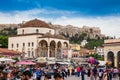 Large group of tourists and locals enjoying a beautiful early spring day at Monastiraki Square in