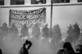 Riot police and protesters during a protest in front of Athens University