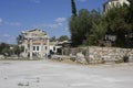 Hadrian library site ruins in Athens through modern houses