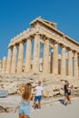 People taking photos in front of the Parthenon