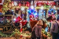 A couple pause to admire the Christmas decorations at Little Kook - a fairy tale themed cafe selling sweets