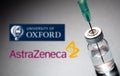 AstraZeneca Oxford vaccine logo on blue background, Covid19 vaccine vial and syringe, Coronavirus immunization Royalty Free Stock Photo