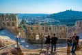 ATHENS, GREECE, DECEMBER 10, 2015: people are admiring the Ancient theater in a summer day in Acropolis Greece, Athnes Royalty Free Stock Photo