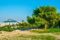 ATHENS, GREECE, DECEMBER 10, 2015: people are having a picnic on philipoppou hill with view on lycabetus hill in athnes