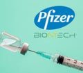 Pfizer and BioNTech logos on blue background, Covid19 vaccine vial and syringe, Coronavirus immunization