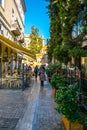 ATHENS, GREECE, DECEMBER 10, 2015: View of a narrow shopping street in the historical district of athens called plaka