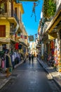ATHENS, GREECE, DECEMBER 10, 2015: View of a narrow shopping street in the historical district of athens called plaka