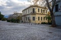 Athens, Greece, early morning in Dionysiou Areopagitou street under acropolis hill in winter. Neoclassical buildings, bare trees