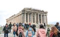 Athens, Greece - February 23, 2019: Tourists visit Parthenon temple at the Acropolis in Athens. View on the side of the western