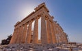 Athens Greece, impressive view of Parthenon ancient temple standing against the sun on Acropolis hill.