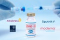 Bottle of Pfizer coronavirus vaccine with the Sputnik V, Moderna, Astra Zeneca and Oxford University logos as background Royalty Free Stock Photo