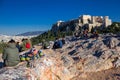 Athens, Greece, January 30 2018: People enjoy the view to the city of Athens from the hill of Areopagus Royalty Free Stock Photo