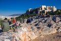 Athens, Greece, January 30 2018: People enjoy the view to the city of Athens from the hill of Areopagus Royalty Free Stock Photo