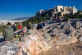 Athens, Greece, January 30 2018: People enjoy the view to the city of Athens from the hill of Areopagus Royalty Free Stock Photo